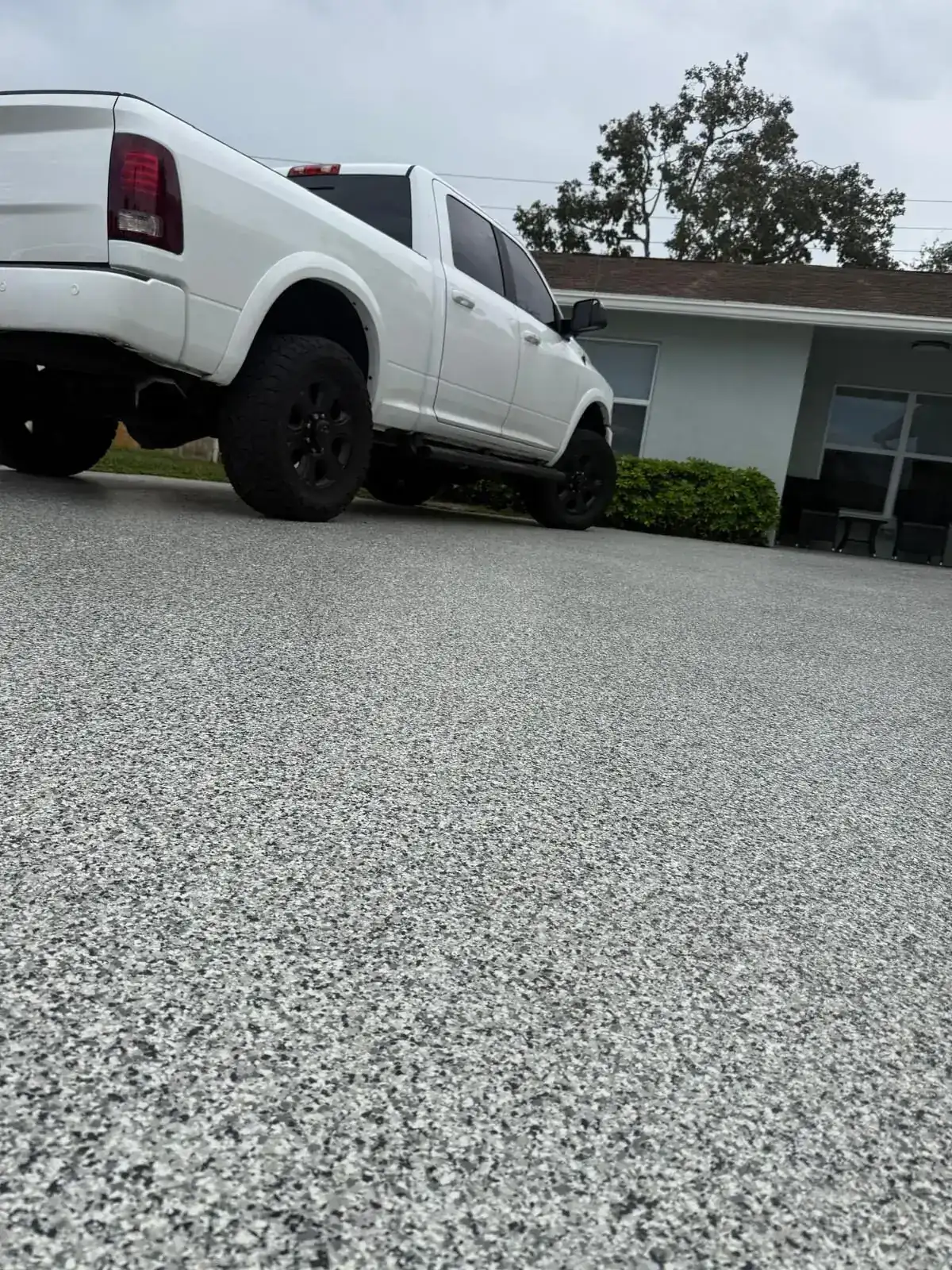 Garage entrance with gray and white flake flooring, South Florida